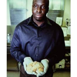 Communications director Brian Browne presents one of the 3,000-odd donor brains harvested at the Banner Sun Health Research Institute. phm0412 du7 lg