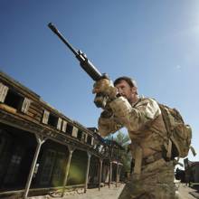 Cowtown’s military training liaison practices tactical moves on the range’s Western movie set. phm1212 gu5 md