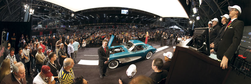 A Barrett-Jackson auctioneer solicits bids for a 1958 Corvette convertible owned by GM CEO Dan Ackerson. The winning $270,000 bid was donated to Habitat for Humanity.
