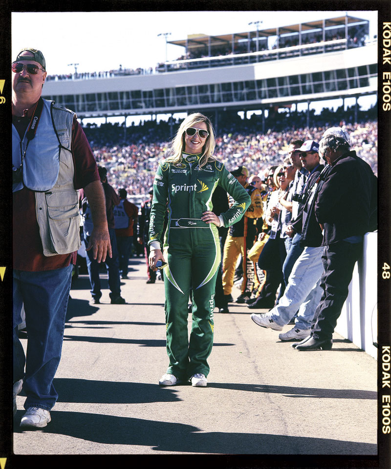 Brand rep Kim Coon of Orlando &ndash; aka Miss Sprint Cup &ndash; poses at the pit.