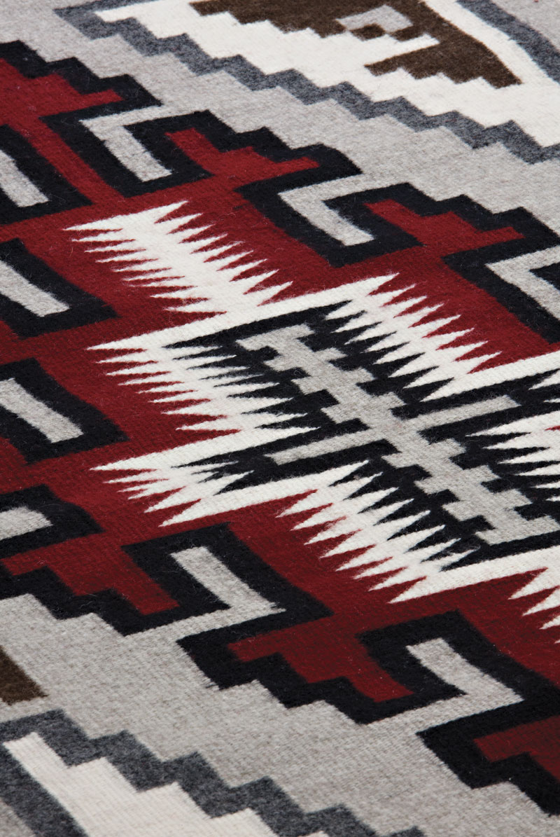 This red and black "blanket-style" Navajo dress (1980s), made by Navajo/Seminole artist Margaret Wood (b. 1950), was a gift of Tom Galbraith and the artist. It is one of several articles of Native American fashion in the exhibit American Indian Fashion: From Lloyd Kiva New to Now, at Heard Museum North