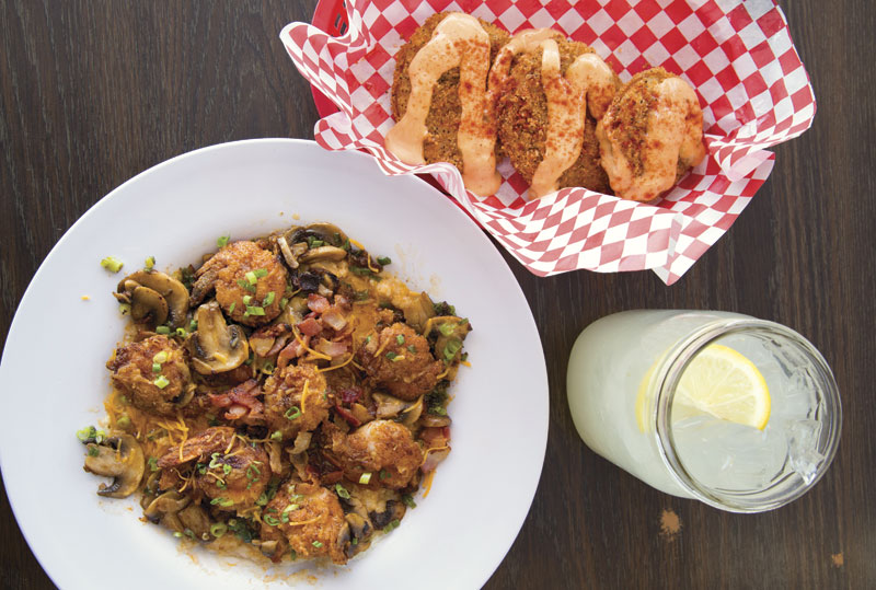 Photo by Brian Goddard; Shrimp and grits and fried green tomatoes at Lo-Lo's Chicken and Waffles