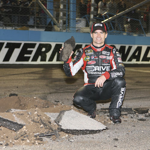 2011 Sprint Cup race winner Jeff Gordon digs up the first piece of asphalt for the repavement of PIR’s track that year. PHM0214PFHist2