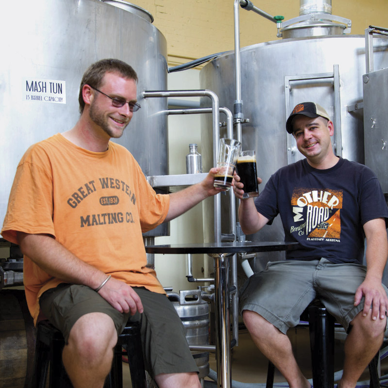 Photo By Brian Goddard; "Head yeast whisperer" Urs Riner and "Captain Cooperage" Shawn MacKenzie of Mother Road Brewing Company