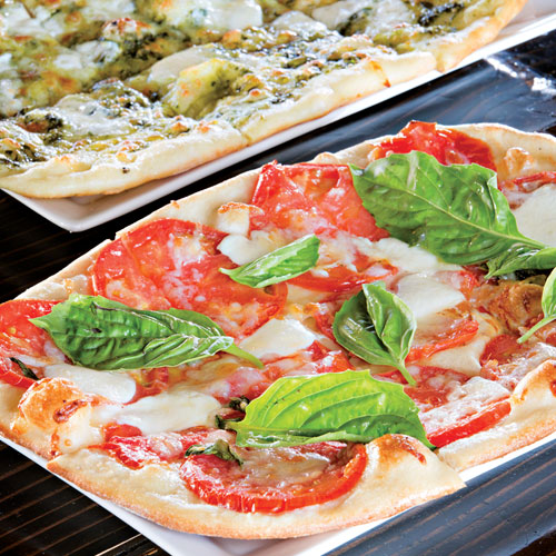 Bianca flatbread (front) and mozzarella pesto flatbread Bianca flatbread (front) and mozzarella pesto flatbread
