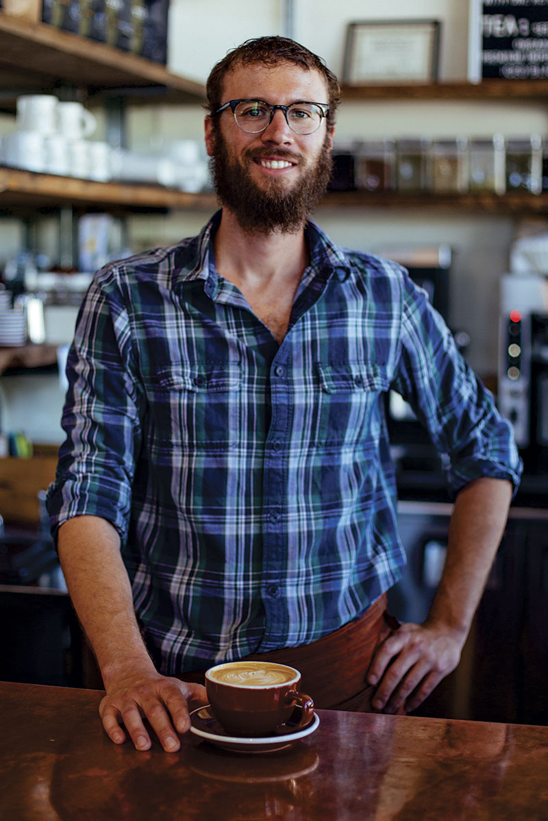 photo by David Venezia; A barista displays his wares at Time Market