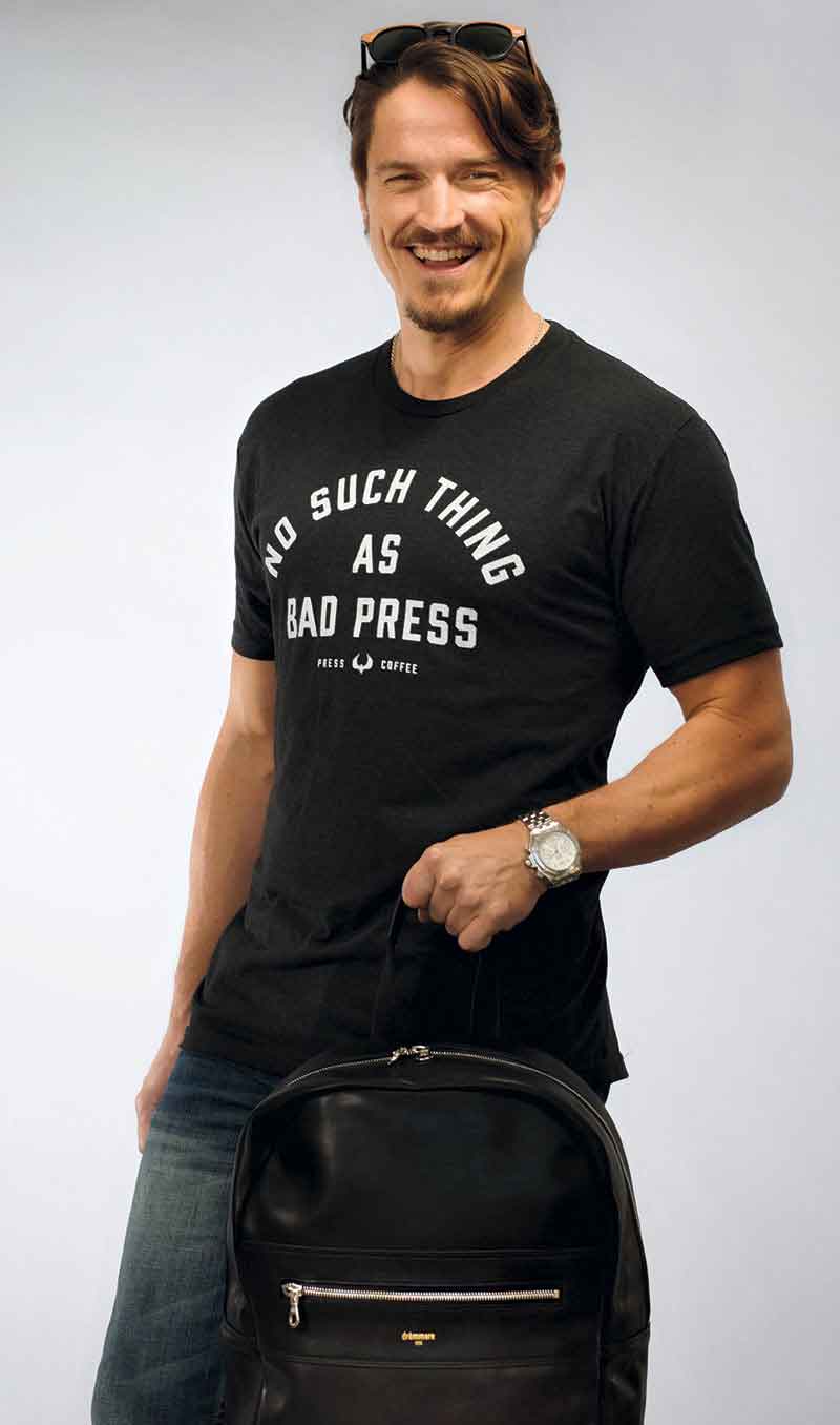 model: Tim Schwimmer; photo by Carrie Evans, shirt: Press Coffee Roasters, glasses: Framed Ewe, bag: drömmare model: Tim Schwimmer; photo by Carrie Evans