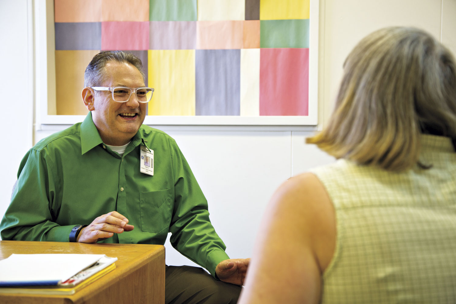 Peter “Chip” Coffey, Director of Therapy Services at St. Luke's Behavioral Health Center, confers with Sue Lynn Harambasic, an RN in his department.; photo by Mirelle Inglefield Peter “Chip” Coffey, Director of Therapy Services at St. Luke's Behavioral Health Center, confers with Sue Lynn Harambasic, an RN in his department.; photo by Mirelle Inglefield