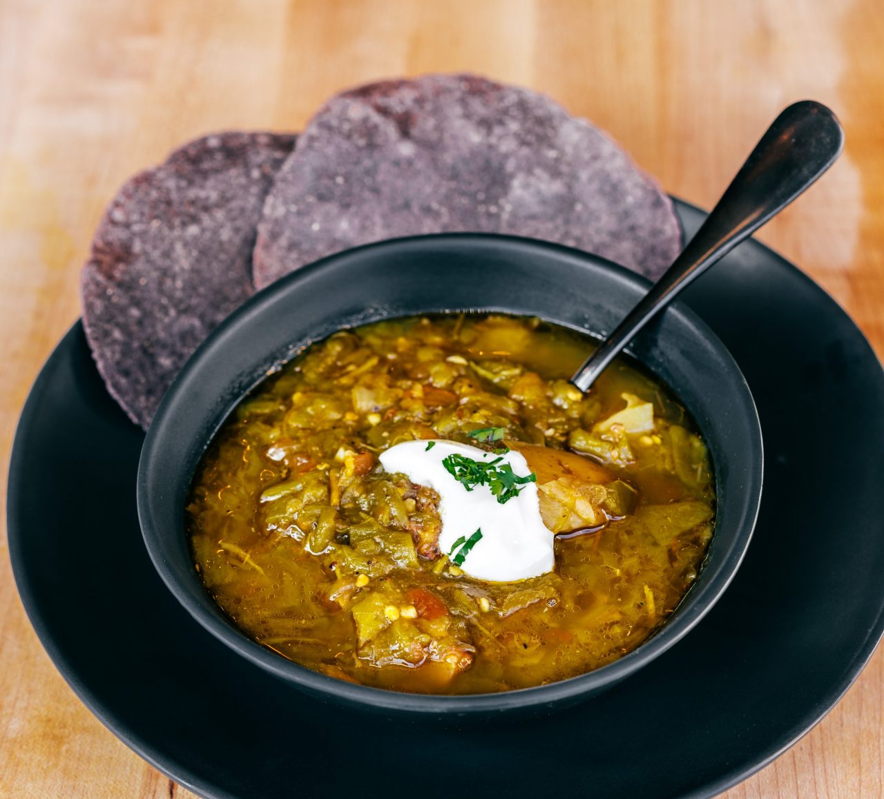 https://www.phoenixmag.com/wp-content/uploads/2022/07/HOB-Close-up-of-Green-Chili-Stew-Emma-1280x1157.jpg