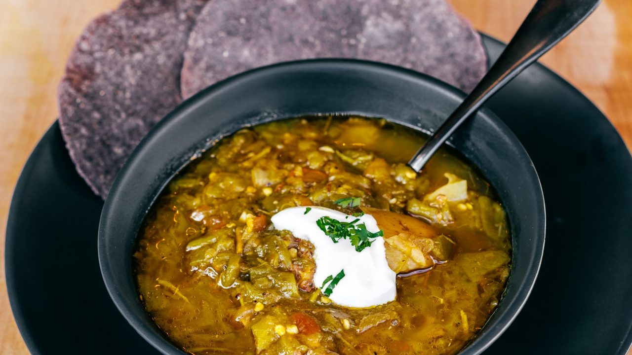https://www.phoenixmag.com/wp-content/uploads/2022/07/HOB-Close-up-of-Green-Chili-Stew-Emma-1280x720.jpg