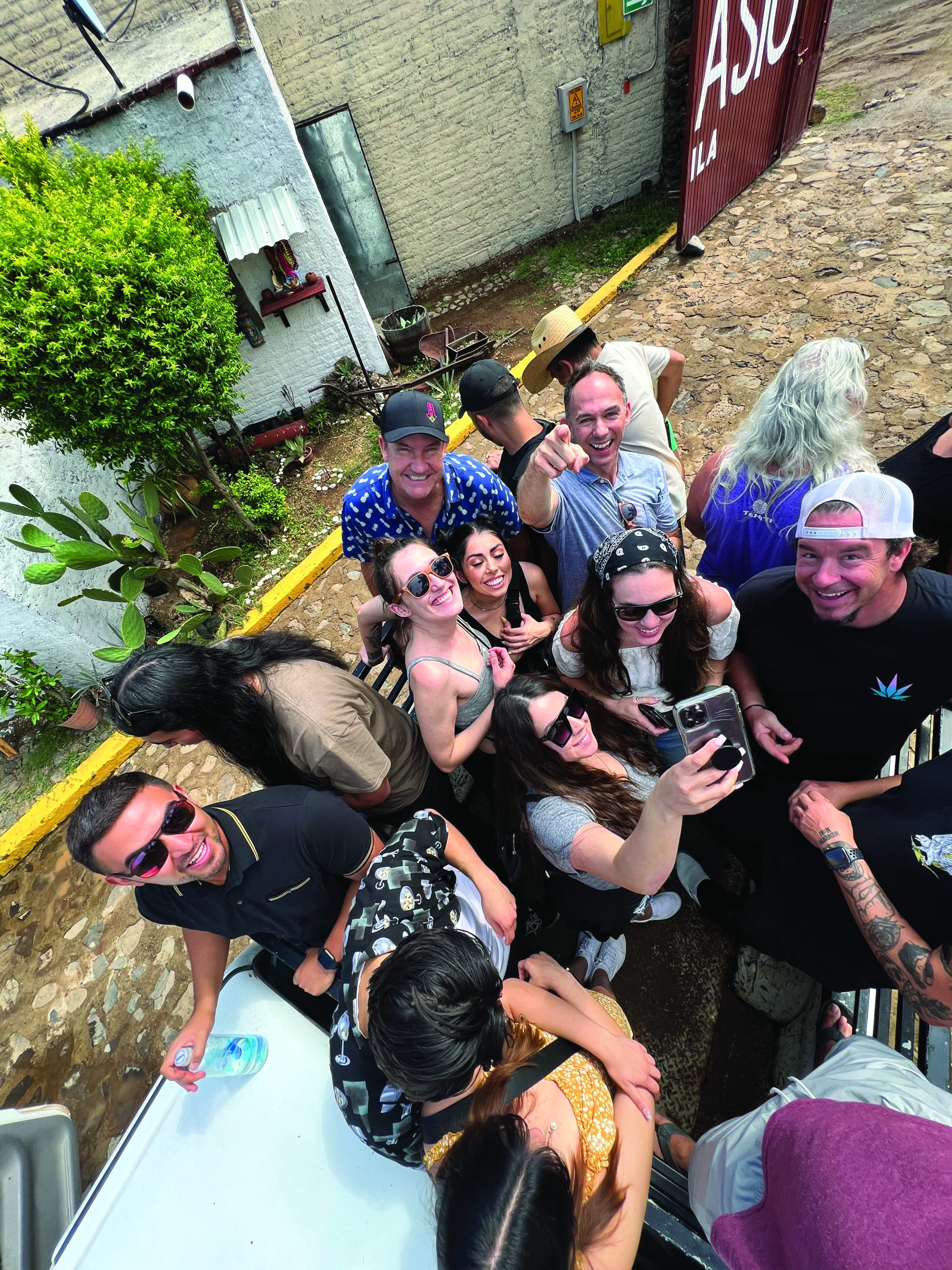 The Barcoa team during a pickup-truck tour of the Atanasio Tequila farm