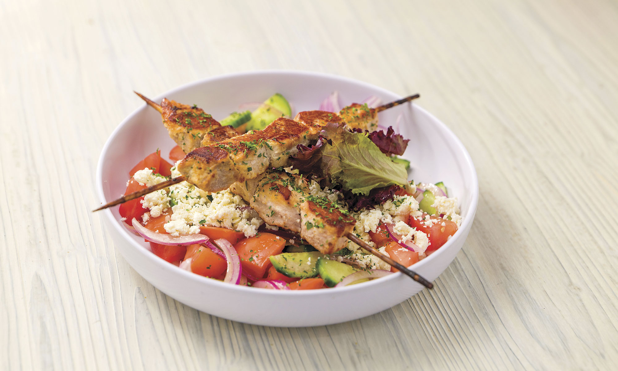 Shopska salad with chicken skewers; photo courtesy Café Balkan Shopska salad with chicken skewers; photo courtesy Café Balkan