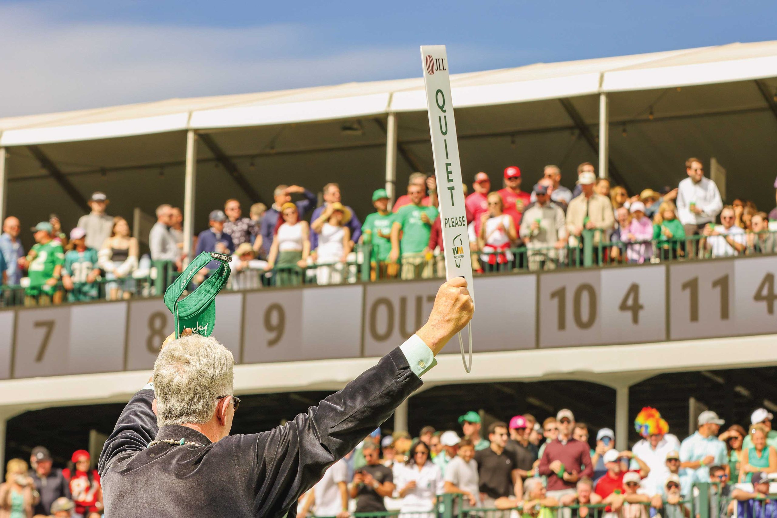 Jock Holliman quiets the crowd with his iconic sign. Photo by Andrew Lwowski. Jock Holliman quiets the crowd with his iconic sign. Photo by Andrew Lwowski.
