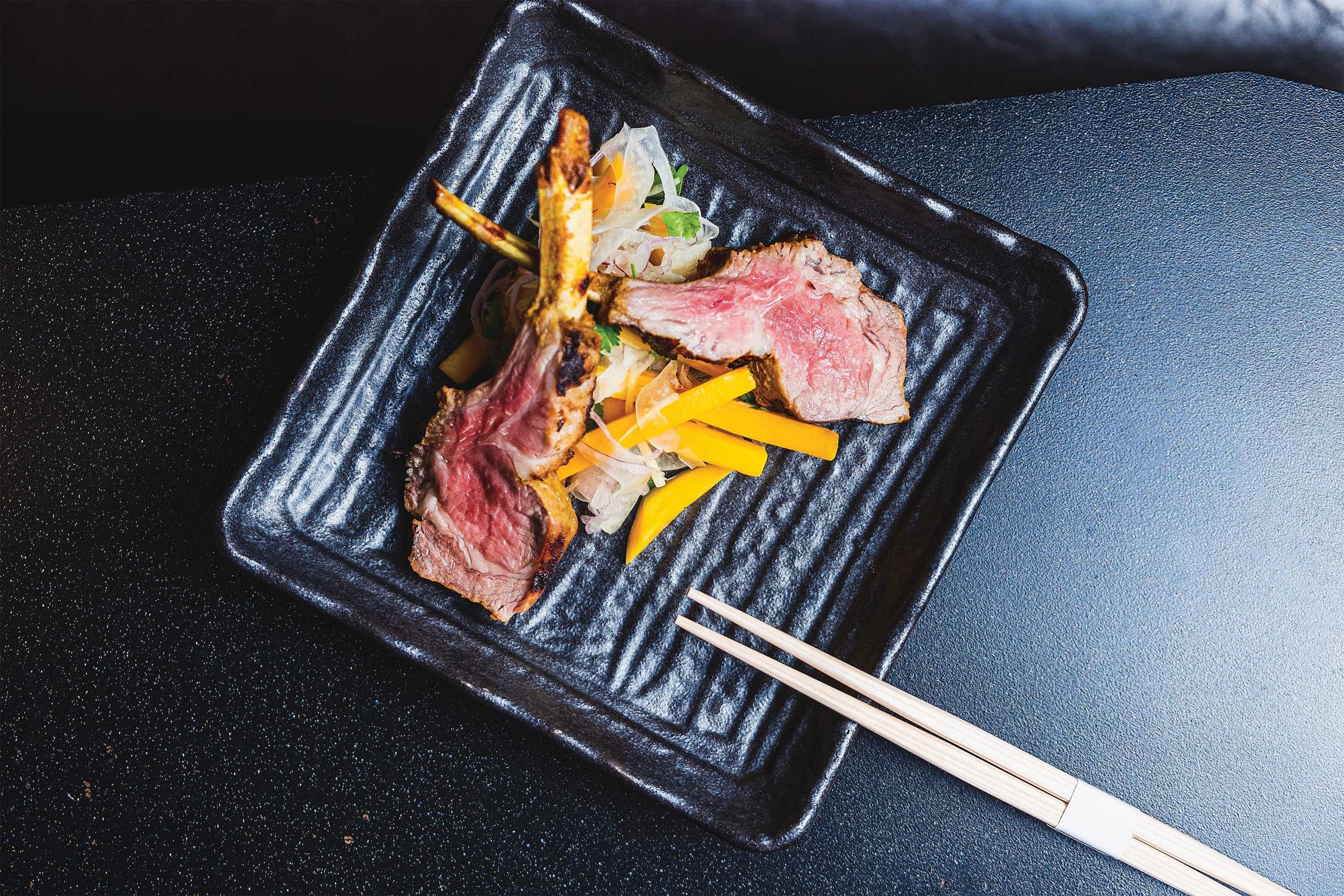 Coconut curry-marinated lamb with mango-fennel salad