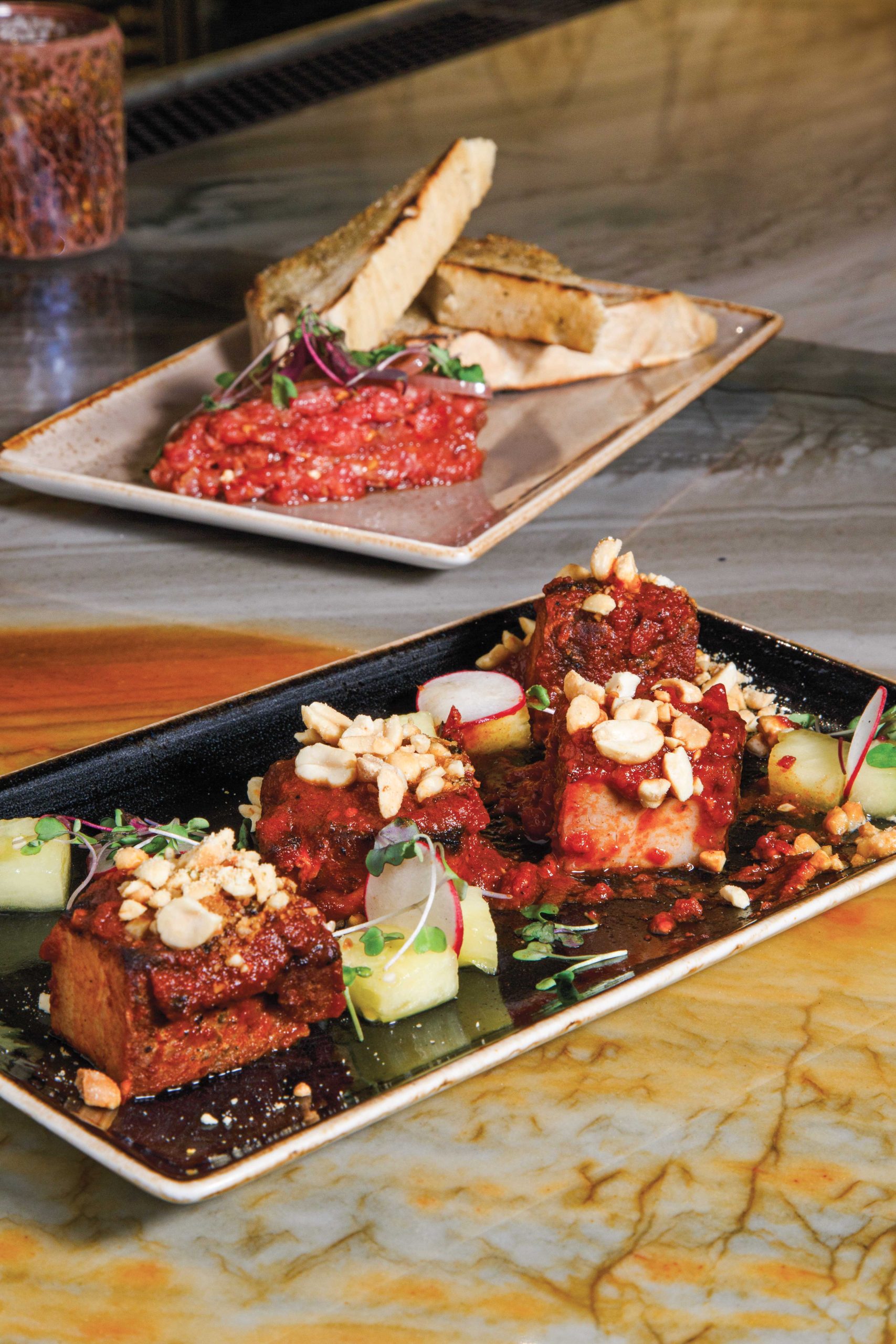 Pork belly with cured watermelon and peanuts and ribeye tartare