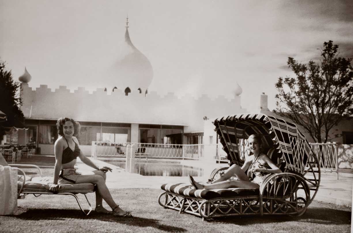 The historic property was converted into a resort in 1953. In this undated photo, guests relax by the pool. The historic property was converted into a resort in 1953. In this undated photo, guests relax by the pool.