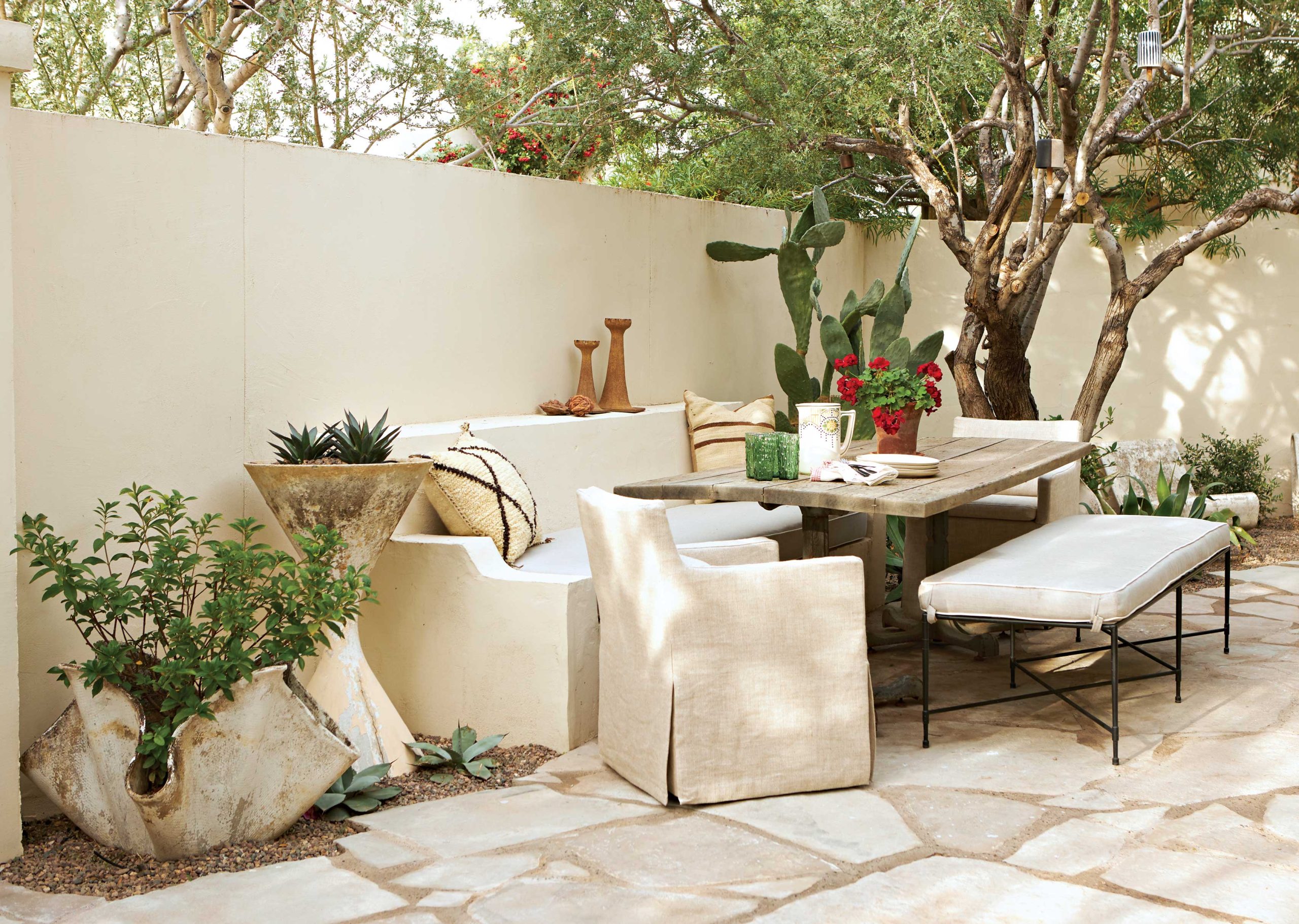 Grant sourced the flagstone from a quarry in Wisconsin and had it trucked to Arizona. “We searched everywhere for the right texture and color tone,” he says. “I wanted the trees and vegetation to be the story.” Grant sourced the flagstone from a quarry in Wisconsin and had it trucked to Arizona. “We searched everywhere for the right texture and color tone,” he says. “I wanted the trees and vegetation to be the story.”