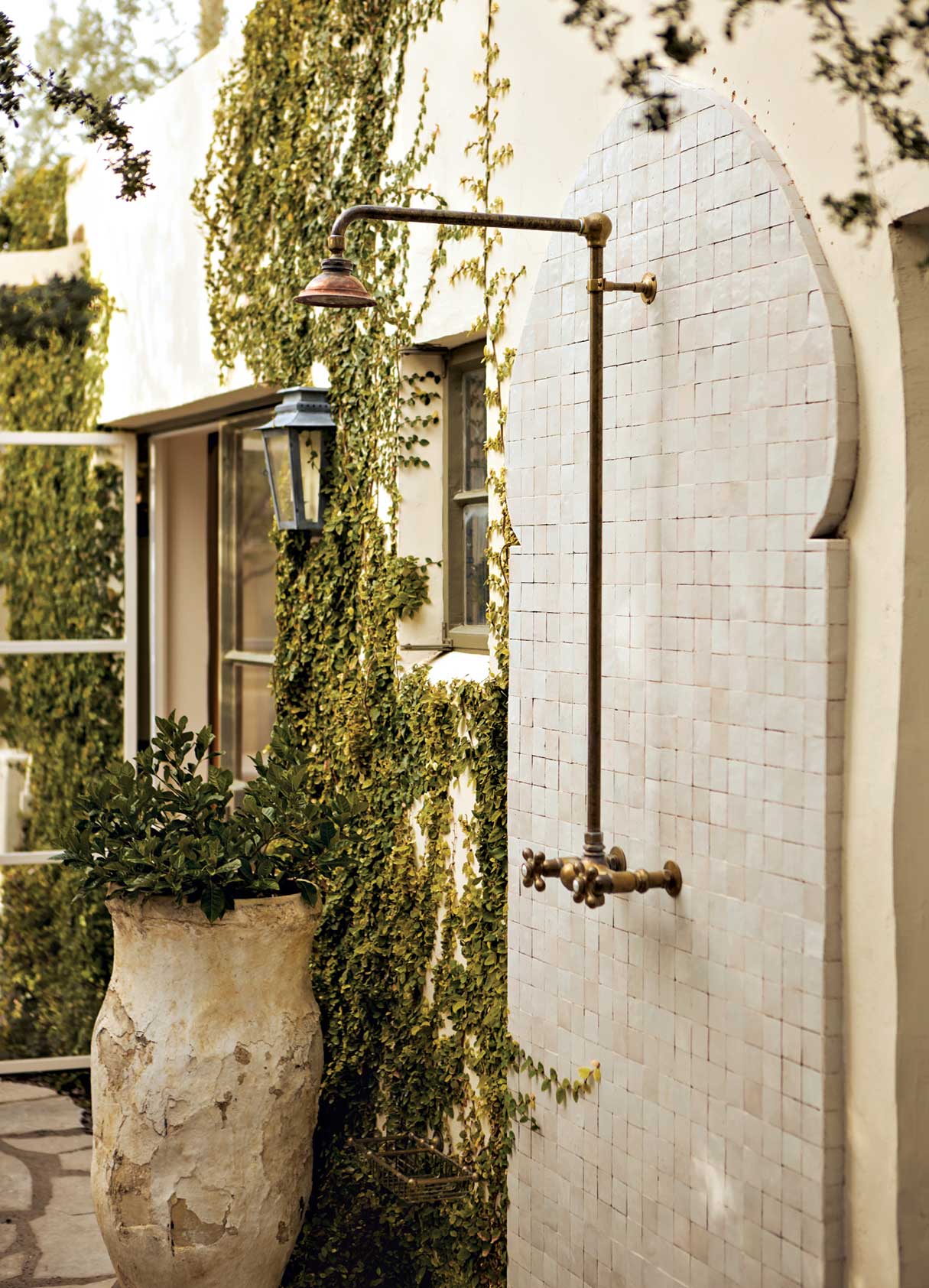 An outdoor shower with a Moorish-themed tile surround was a special request of Grant’s. An outdoor shower with a Moorish-themed tile surround was a special request of Grant’s.
