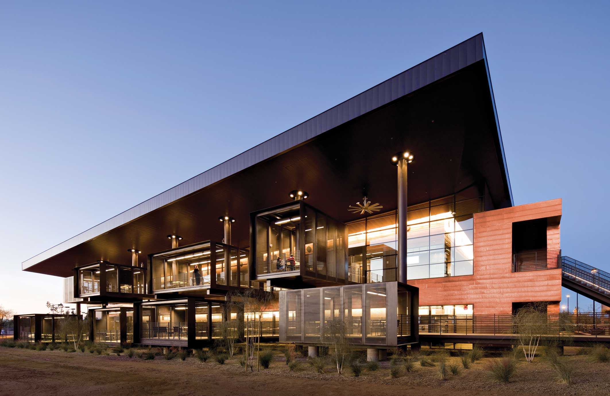 A series of permeable yet protected exterior pods creates spaces for students and faculty to plug in and collaborate at Paradise Valley Community College, designed by architect Marlene Imirzian. The massive roof provides ample shade while collecting rainwater for use in irrigation.