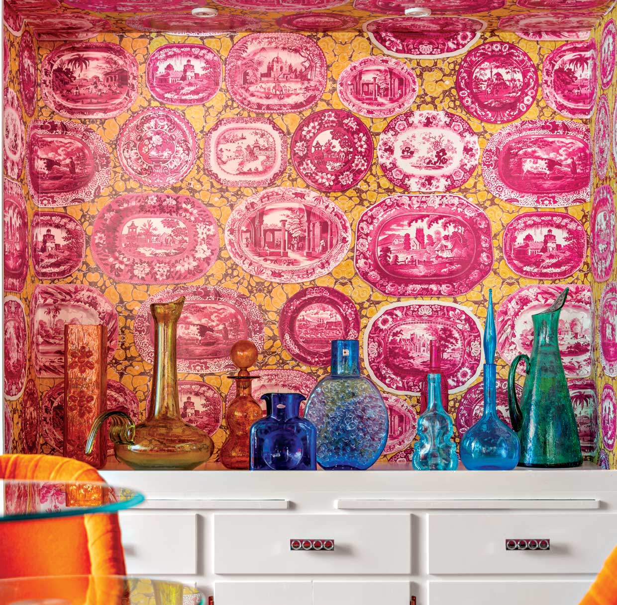 By removing the inset shelves from the original built-in dining room cabinetry, Buckingham created a niche to show off her love of wild wallpaper. By removing the inset shelves from the original built-in dining room cabinetry, Buckingham created a niche to show off her love of wild wallpaper.
