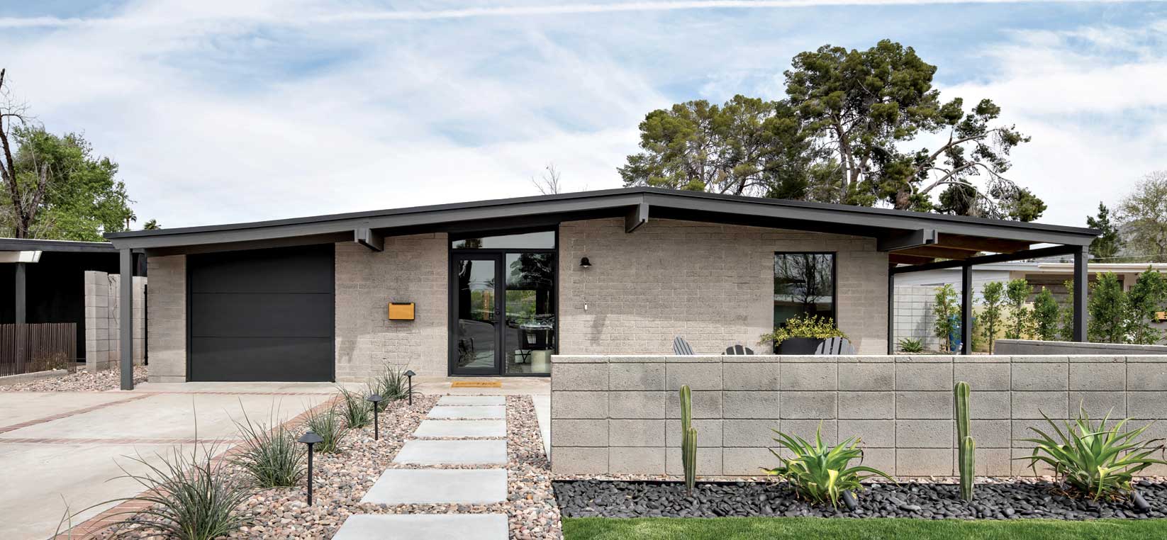 Using black and charcoal as accent colors, architectural and landscape designer Joel Contreras sandblasted all of the existing block, adding a stacked masonry pony wall, which honors Haver’s use of the original brick. The driveway, carved into six sections by red brick borders, survives from when the homeowners purchased the property. Using black and charcoal as accent colors, architectural and landscape designer Joel Contreras sandblasted all of the existing block, adding a stacked masonry pony wall, which honors Haver’s use of the original brick. The driveway, carved into six sections by red brick borders, survives from when the homeowners purchased the property.