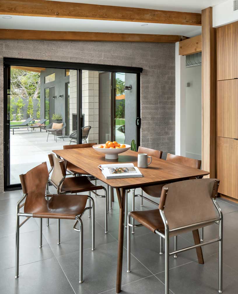 The dining area almost feels as if it’s outdoors. The gray hue of the sandblasted interior block walls are similar to the addition’s exterior. The dining area almost feels as if it’s outdoors. The gray hue of the sandblasted interior block walls are similar to the addition’s exterior.