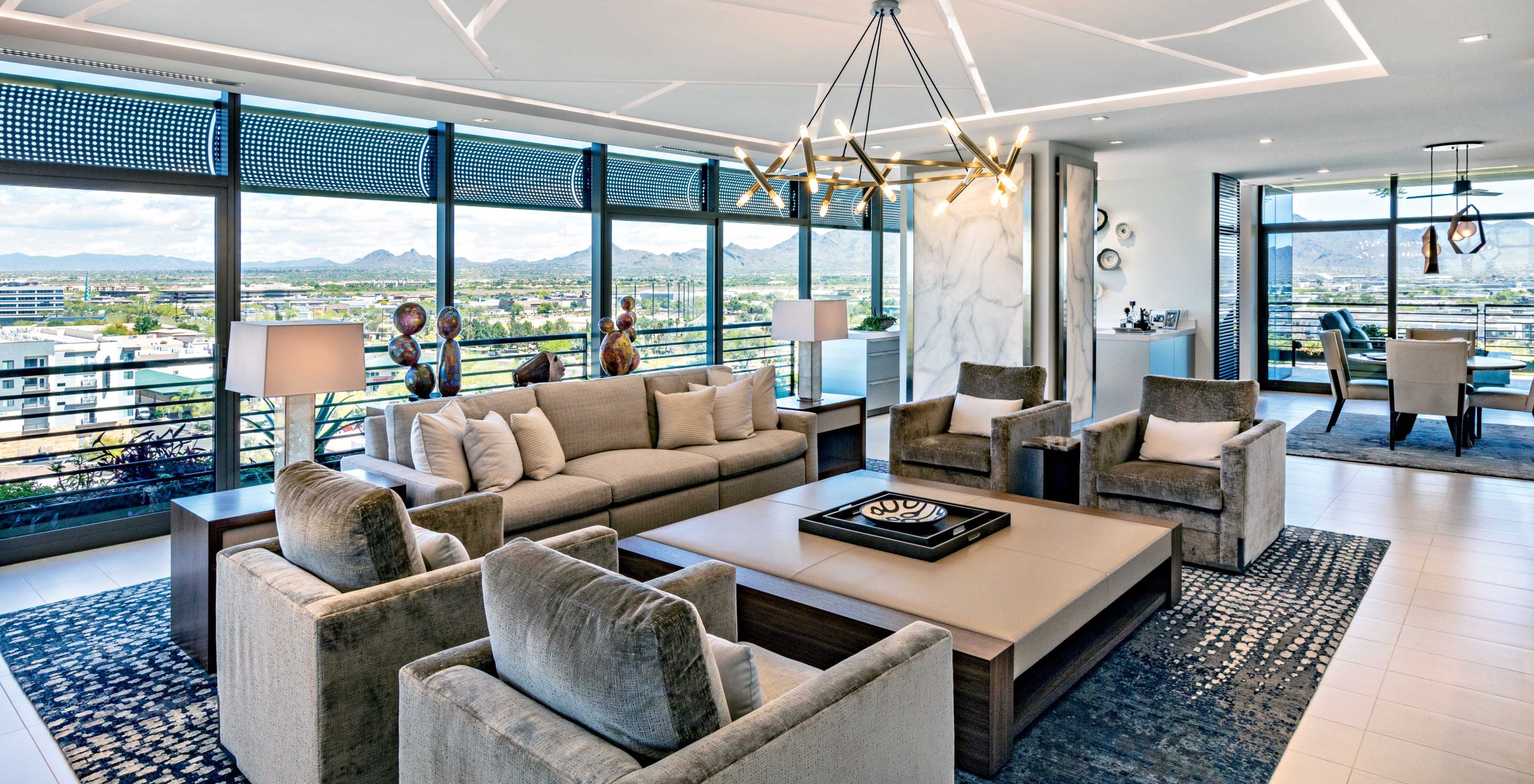 According to late interior designer Tony Sutton, it’s not scale that gives the great room its name, but the grandness of the setting balanced with the artful assemblage of furnishings and decor that create a suitable stage for the desertscape outside. The fragmented forms that comprise the ceiling recall the jagged peaks of the mountains that ring the Valley. According to late interior designer Tony Sutton, it’s not scale that gives the great room its name, but the grandness of the setting balanced with the artful assemblage of furnishings and decor that create a suitable stage for the desertscape outside. The fragmented forms that comprise the ceiling recall the jagged peaks of the mountains that ring the Valley.