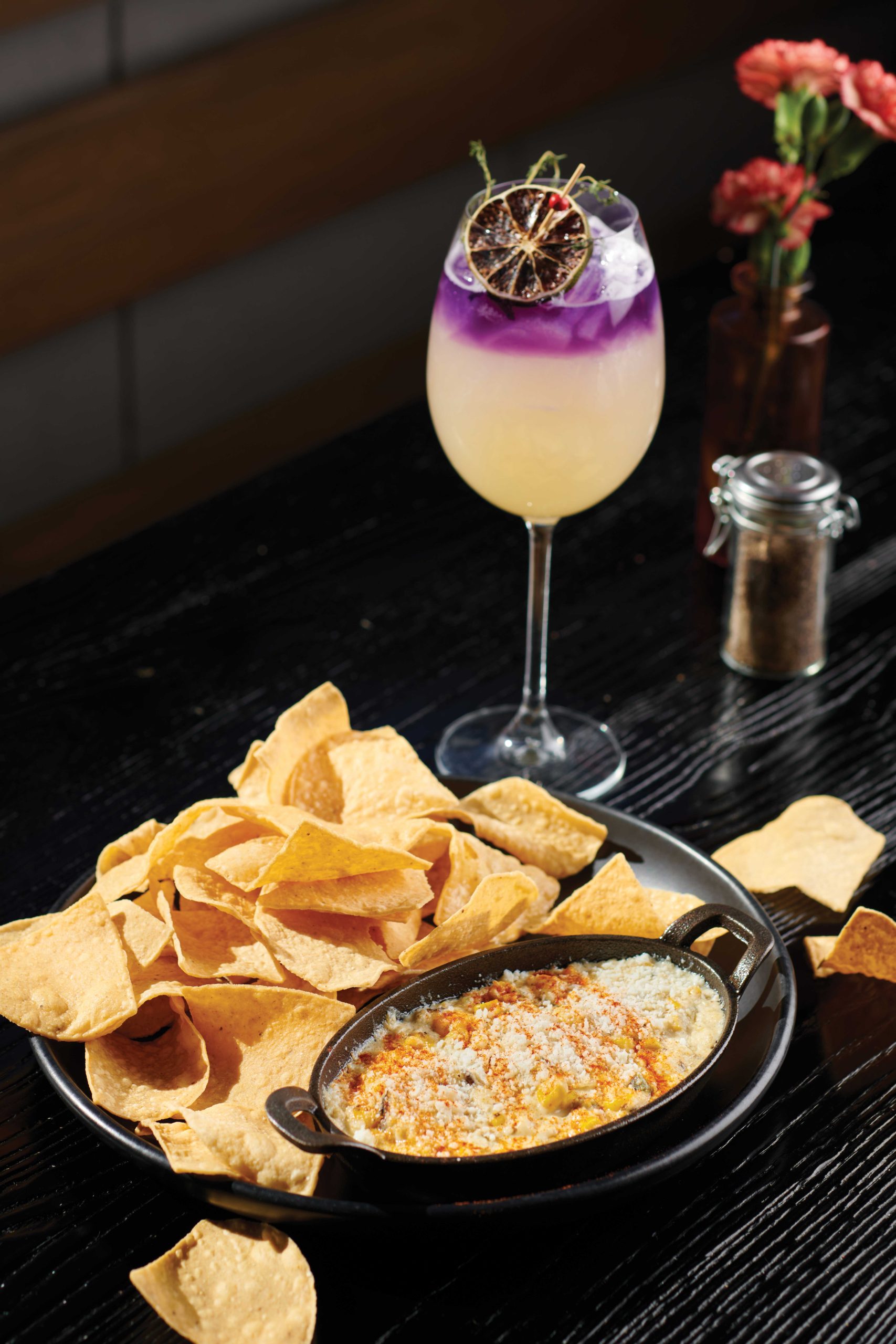 street corn queso with Buckhorn Baths cocktail