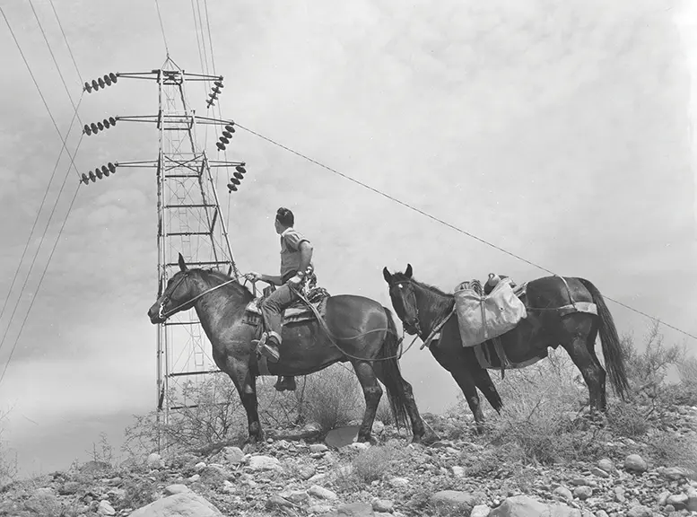 Photo Courtesy APS. Lineworkers on horseback Photo Courtesy APS. Lineworkers on horseback
