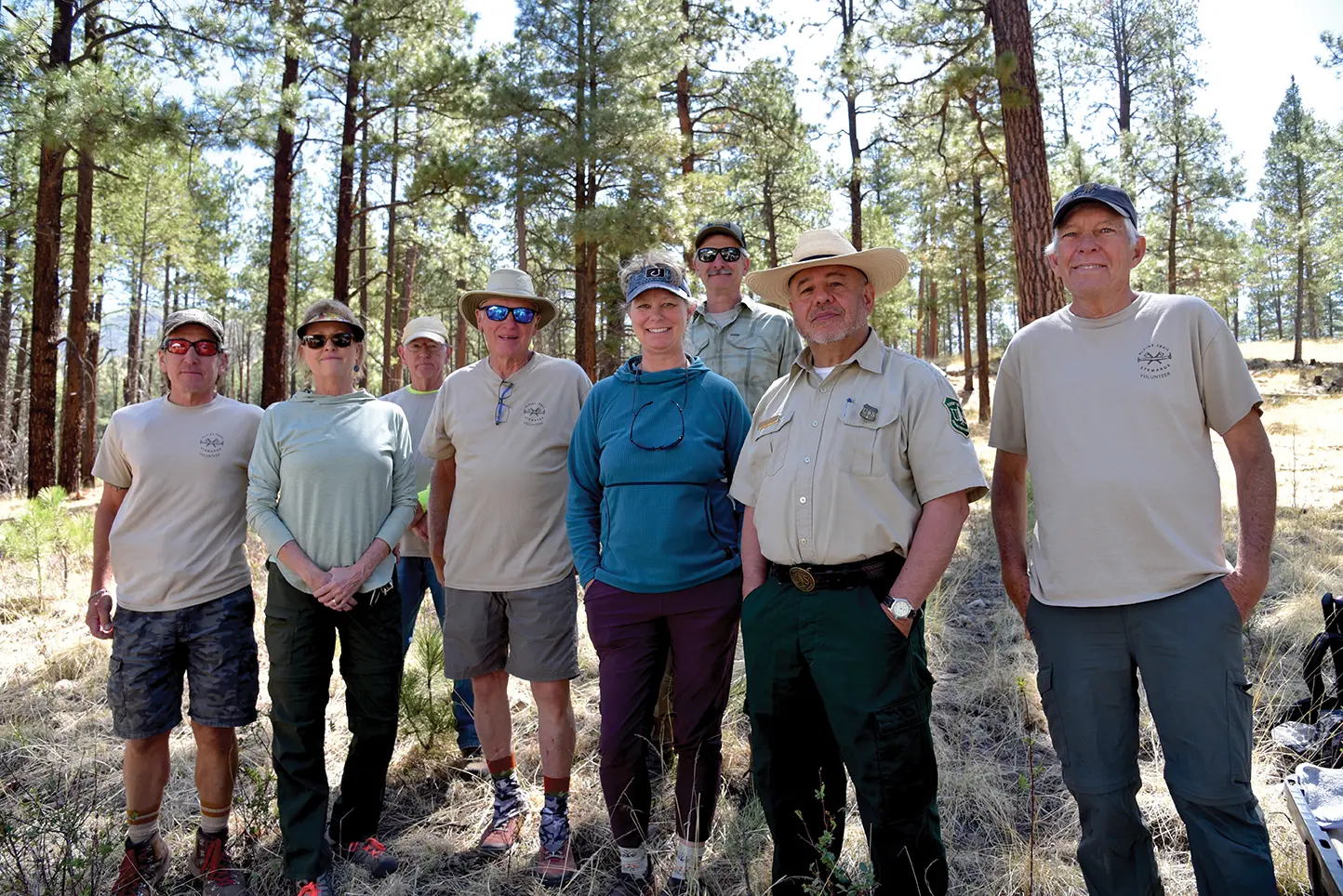 Debbie Fogle (center, blue shirt) with Alpine Trail Stewards and Forest Service representatives. Photos by Mare Czinar; courtesy Debbie Fogle Debbie Fogle (center, blue shirt) with Alpine Trail Stewards and Forest Service representatives. Photos by Mare Czinar; courtesy Debbie Fogle
