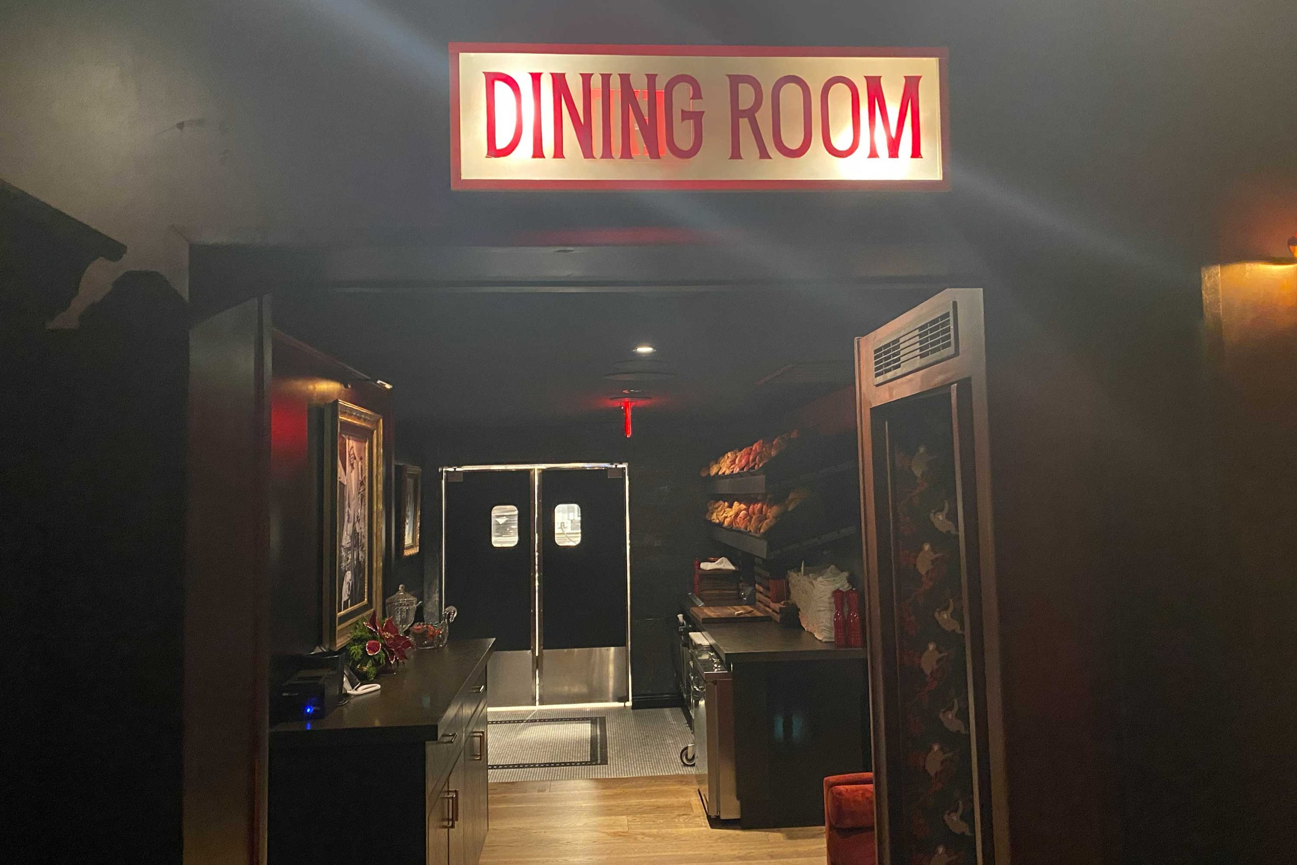 Neon signs, porterhouse club plaques, portraits and a phone booth still adorn the interiors