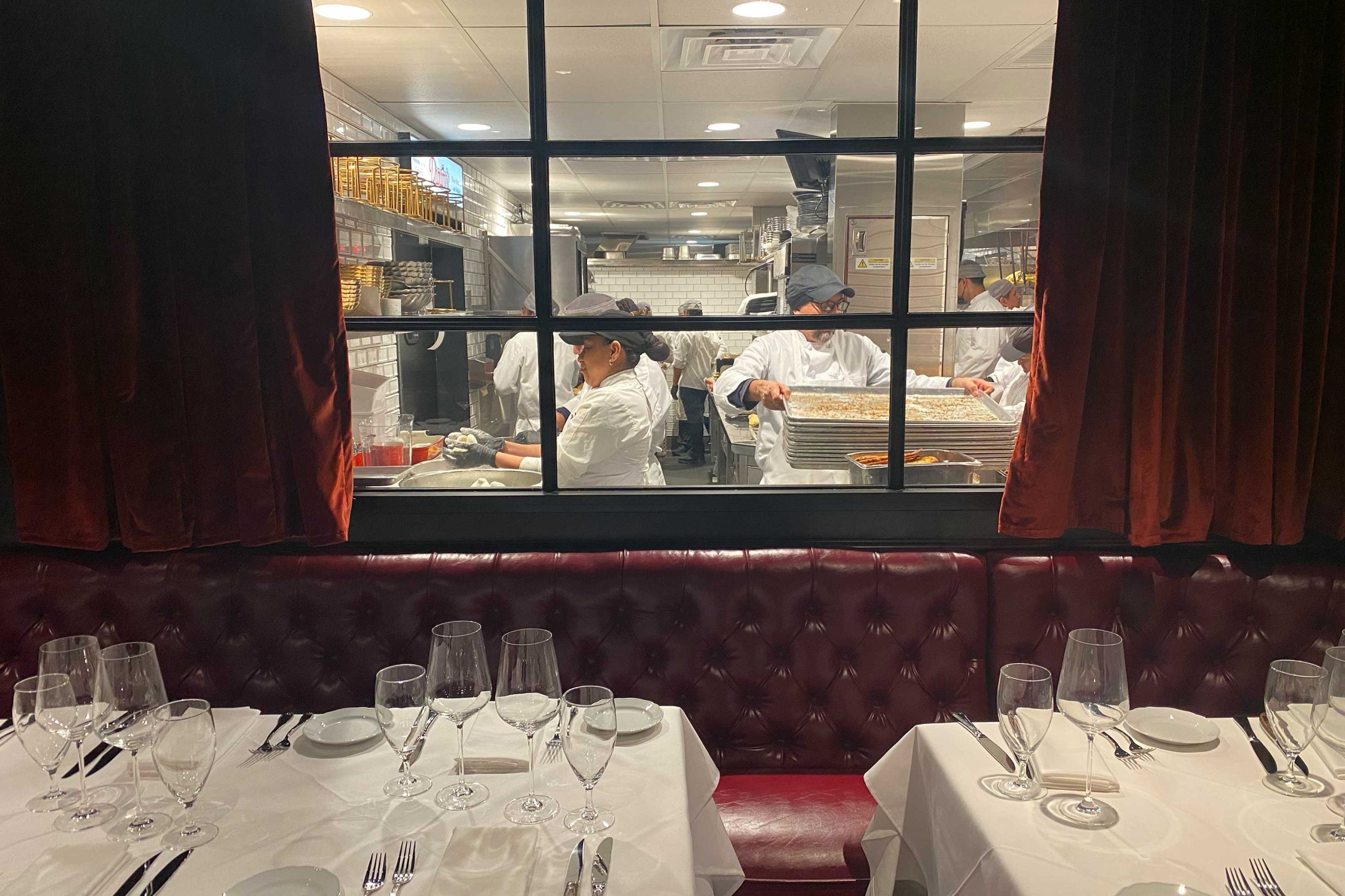 a small section of the dining room looks into the upgraded gourmet kitchen
