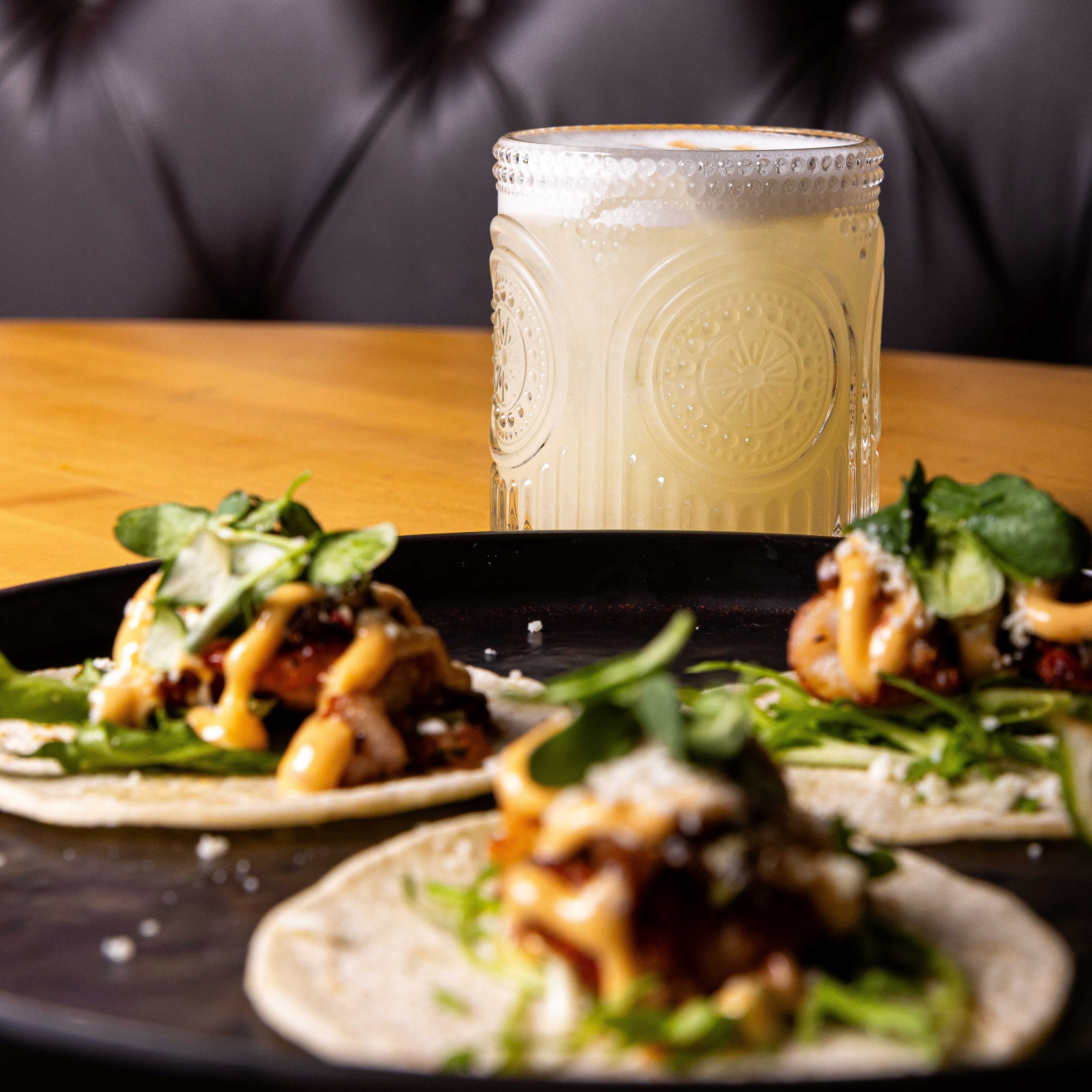 Shrimp tacos with a Pisco Sour cocktail Shrimp tacos with a Pisco Sour cocktail