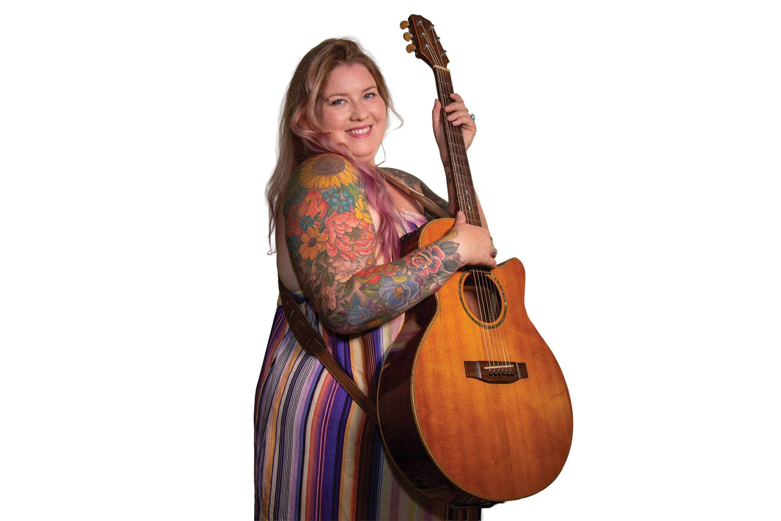 Purchased 12 years ago at a Tempe Best Buy, Green’s acoustic Takamine has turned into a road-tested companion. “She’s been through a lot,” Green says. “She’s a workhorse.” Purchased 12 years ago at a Tempe Best Buy, Green’s acoustic Takamine has turned into a road-tested companion. “She’s been through a lot,” Green says. “She’s a workhorse.”