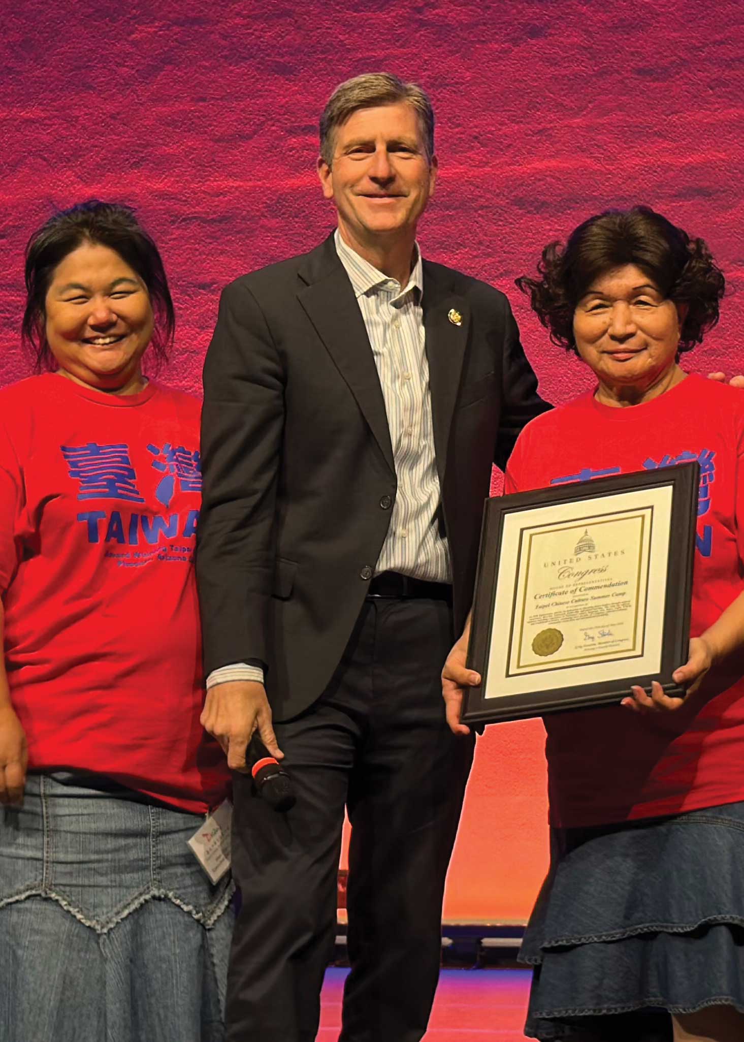 U.S. Congressman Greg Stanton presenting a congressional commendation to camp organizers